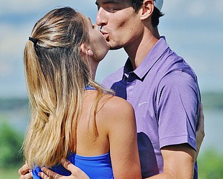 Jeff Lange | The Vindicator  SUN, AUG 21, 2016 - In celebration of winning the Pete Mollica Men's Open Division championship, Brandon Pluchinsky kisses his girlfriend, Samantha Marucci of Canfield, after the final round of the 2016 Farmers Bank Greatest Golfer of the Valley competition held at the Lake Club in Poland, Sunday, Aug. 21, 2016.