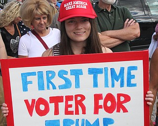 Nikos Frazier | The Vindicator..First time voter, Elizabeth McDermitt of Amherst poses for a photo outside the James A. Rhodes Arena at The University of Akron before Republican presidential candidate Donald Trump speaks at a campaign rally in Akron, Oh., Saturday, Aug. 20, 2016.