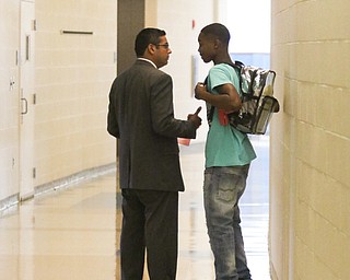        ROBERT K. YOSAY  | THE VINDICATOR..Krish CEO.. talks with a student... at East.... Krish Mohip, city schools chief executive officer, started his first day of school this morning at Discovery Transition to Careers at Volney.... - -30-...