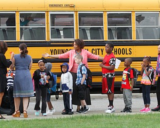        ROBERT K. YOSAY  | THE VINDICATOR.. At MLK..  teachers line up  to be taken into school..Krish Mohip, city schools chief executive officer, started his first day of school this morning at Discovery Transition to Careers at Volney.... - -30-...