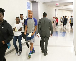        ROBERT K. YOSAY  | THE VINDICATOR.. Krish.. walks the halls of East..Krish Mohip, city schools chief executive officer, started his first day of school this morning at Discovery Transition to Careers at Volney.... - -30-...