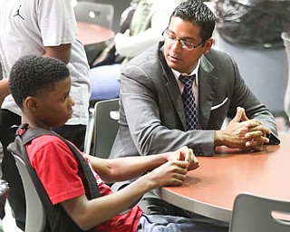        ROBERT K. YOSAY  | THE VINDICATOR...Trent Young.. talks with KrishMohip before the start of school at Volney Rogers.. Krish Mohip, city schools chief executive officer, started his first day of school this morning at Discovery Transition to Careers at Volney.... - -30-.