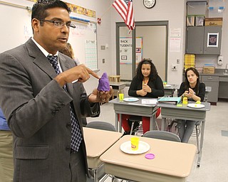        ROBERT K. YOSAY  | THE VINDICATOR.. Krish Mohip molds some playdoh.. students in Cheryl Sherman's class were told to mold something they liked..Behind him is Natalina Colon and Stephanie Rodriquez..Krish Mohip, city schools chief executive officer, started his first day of school this morning at Discovery Transition to Careers at Volney.... - -30-...