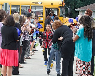        ROBERT K. YOSAY  | THE VINDICATOR.. staff.... applaud students... as they arrive at MLK..Krish Mohip, city schools chief executive officer, started his first day of school this morning at Discovery Transition to Careers at Volney.... - -30-...