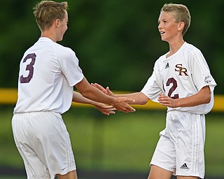 CANFIELD, OHIO - AUGUST 22, 2016: Canaan Johnson #12 (right) of South Range celebrates with teammate Zach Schick #3 after scoring a goal in the first half of their game Monday afternoon at South Range High School. South Range won 10-0. DAVID DERMER | THE VINDICATOR