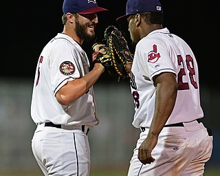 NILES, OHIO - AUGUST 22, 2016: Relief pitcher Kenny Mathews #51 of the Scrappers (left) and Emmanuel Tapia #28 (left) celebrate after the Scrappers defeated the State College Spikes 4-2 at Eastwood Field. DAVID DERMER | THE VINDICATOR
