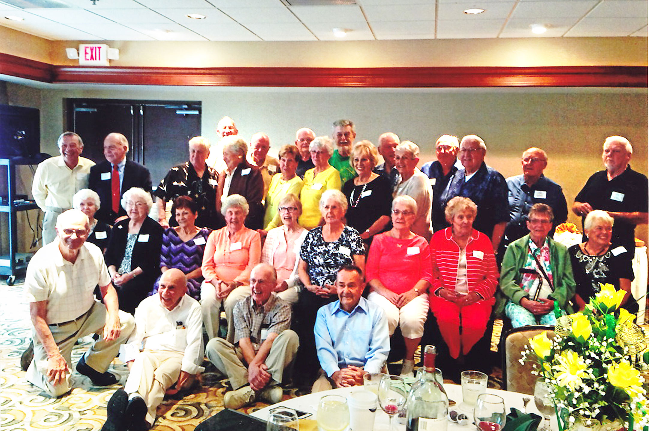 SPECIAL TO THE VINDICATOR
Members of the Ursuline High School Class of 1951 gathered for a 65th class reunion on July 30 at the Hampton Inn in Canfield. Reunion activities for the classmates from July 29 through 31 included a pizza party at Inner Circle in Canfield; a brunch at Bob Evans Restaurant in Canfield; a Mass dedicated to the class at the high school, officiated by the Rev. Richard Murphy, and a video presentation; and a cocktail hour and dinner. Classmates, from left, are kneeling, Tom Klempay; seated on floor, Tom Nakley, Al Lyster and Tom Popovich; second row, Jean Kling Baun, Carroll Dixon Necko, Mary Virginia Cleary Baynes, Theresa Conrecode Nichols, Joyce McGinty Petrunia, Blanche Stratford Lanterman, Sally Kenny Dailey, Mary Lou McGovern Beck, Joann Fitzpatrick Reilley and Millie Charnoki Campean; third row, Ron Galip, Jack Nichols, Guy Schiavone, Patty Eddy, Marian McCarthy Baker, Sally Mullen McGrath, Jacquelyn Trampush Trgovac, Claranne Lyden McCloud, Frank Beck, John Demain and Bill Dochery; and fourth row, John Wanchow, Bob Barrett, John Zamary, Tom Flynn, Joe Ziemianski and Bernie Wilkens. 
