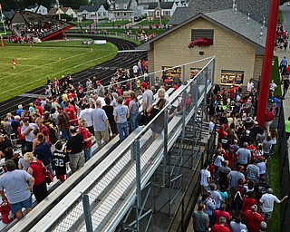 STRUTHERS, OHIO - AUGUST 25, 2016: Fans are evacuated from the stands at the start of a weather delay with 29 seconds left in the first quarter. DAVID DERMER | THE VINDICATOR