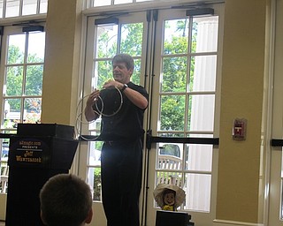 Neighbors | Alexis Bartolomucci.One of Jeff Wawrzaszek's final tricks during his magic show on August 3 at the Poland library was the linking and unlinking of three metal circles.