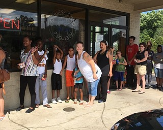 Neighbors | Submitted.People lined up outside of MetroPCS in Austintown on Aug. 13 to receive a backpack from MetroPCS and have a chance to spin the prize wheel from Hot101.
