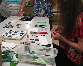 Neighbors | Alexis Bartolomucci.Lynn Cardwell demonstrated how to create a fused glass pendant during her class on Aug. 9 at Fellows Riverside Gardens.