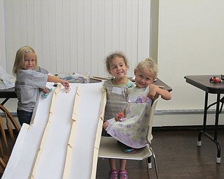 Neighbors | Alexis Bartolomucci.The girls who attended the Cross the Finish Line event at the Boardman library on Aug. 11 created their own cars to race down the ramp.