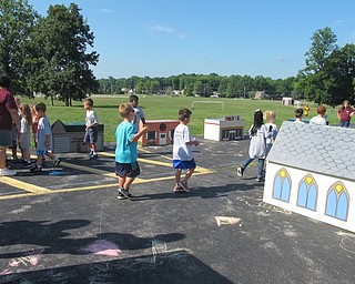 Neighbors | Alexis Bartolomucci.The children participating in the Safety Village program at Boardman Glenwood Middle School on Aug. 11 pretended they were driving cars in a city they put together and practiced safety precautions.