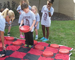 Neighbors | Alexis Bartolomucci.There was a life-size game of checkers the children at Safety Village at Glenwood Middle School played as a break from the other activites on Aug. 11.