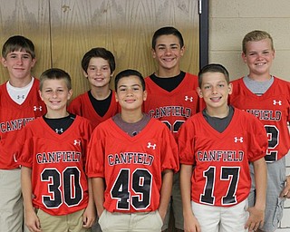 Neighbors | Abby Slanker.Several members of the eighth-grade football team prepared for their shift at the Canfield Gridiron Club’s ninth annual Meet the Team Steak Fry on Aug. 13.