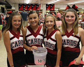 Neighbors | Abby Slanker.Members of the eighth-grade cheerleading squad were on hand to help sell 50/50 tickets at the Canfield Gridiron Club’s ninth annual Meet the Team Steak Fry on Aug. 13.