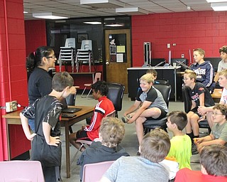 Neighbors | Abby Slanker.Youngstown State University computer science professor Dr. Bonita Sharif (left) shared an eye tracking demonstration with attendees of the third annual Robotics Camp on Aug. 4.