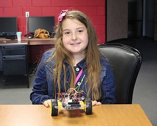 Neighbors | Abby Slanker.Canfield Village Middle School fifth-grader Erica Kovach showed off the robot she built while attending the third annual Robotics Camp on Aug. 4.
