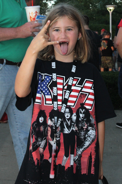 Nikos Frazier | The Vindicator..Alyssa Sciulli, 7, of Pittsburgh poses for a photo outside the Covelli Center before the KISS concert Friday night. This was Alyssa's first concert.