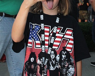 Nikos Frazier | The Vindicator..Alyssa Sciulli, 7, of Pittsburgh poses for a photo outside the Covelli Center before the KISS concert Friday night. This was Alyssa's first concert.