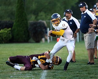  .          ROBERT  K. YOSAY | THE VINDICATOR..No where to go as  McDonald #13 Dylan Portolese  tries to get a few extra yards a he drags South Range #14 Aniello Buzzacco.. during second quarter action ..McDonald at South Range in North Lima..-30-
