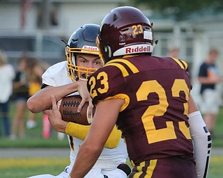  .          ROBERT  K. YOSAY | THE VINDICATOR..McDonald #13 Dylan Portolese.. Gets prepared to be stopped at the line by South Range #23 David Pecchia  during first quarter action..McDonald at South Range in North Lima..-30-