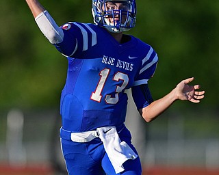 BERLIN CENTER, OHIO - AUGUST 26, 2016: Quarterback Wyatt Larimer #13 of Western Reserve throws a touchdown pass in the first half of their game Friday night at Western Reserve High School. DAVID DERMER | THE VINDICATOR