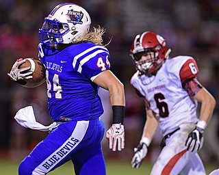 BERLIN CENTER, OHIO - AUGUST 26, 2016: Running back Austin Seifert #44 of Western Reserve breaks away from Zach Philips #6 of Columbia on his way into he end zone to score a touchdown in the second half of their game Friday night at Western Reserve High School. DAVID DERMER | THE VINDICATOR