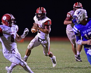BERLIN CENTER, OHIO - AUGUST 26, 2016: Quarterback Mitch Davidson #2 of Columbiana runs the football behind the block of teammate Jarrett Nemick #8 on his way into the end zone for a rushing touchdown in the second half of their game Friday night at Western Reserve High School. DAVID DERMER | THE VINDICATOR