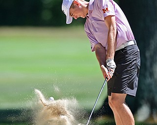 LIBERTY, OHIO - AUGUST 29, 2016: Ken Keller of Mooney chips out of the bunker on the seventh hole Monday afternoon at the Youngstown Country Club during the Ursuline Invitational. DAVID DERMER | THE VINDICATOR