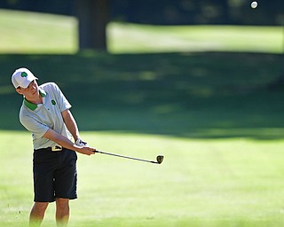LIBERTY, OHIO - AUGUST 29, 2016: Danny Brooks of Ursuline follows through on his approach shot on the seventh hole Monday afternoon at the Youngstown Country Club during the Ursuline Invitational. DAVID DERMER | THE VINDICATOR