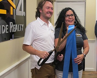 Neighbors | Alexis Bartolomucci.George Berick, owner of Lakeside Realty, stood with his wife, Teresa, at the new building of Lakeside Realty on Aug. 18 in Austintown.