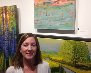 Neighbors | Submitted.Jenna Hudock stood next to her paintings that she had in the Trumbull Art Gallery's 52 Annual Artist Show running throughout the month of August.