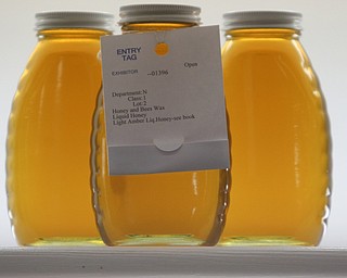        ROBERT K. YOSAY  | THE VINDICATOR..Pure Honey as it sits awaiting judging at the Canfield Fair-honey is measured on clarity moisture content and flavor... - -30-...