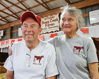        ROBERT K. YOSAY  | THE VINDICATOR..Gordon and Beverly Withers. Honey Creek Farms, which marks its 100th year showing cattle at the Canfield Fair.... - -30-...