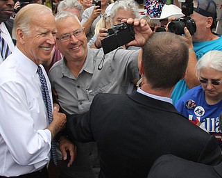 Nikos Frazier | The Vindicator..Vice President Joe Biden takes a selfie with a supporter at the Canfield Fair on Thursday, Sept. 1, 2016.