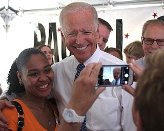 Nikos Frazier | The Vindicator..Vice President Joe Biden takes a photo with a supporter at the Canfield Fair on Thursday, Sept. 1, 2016.