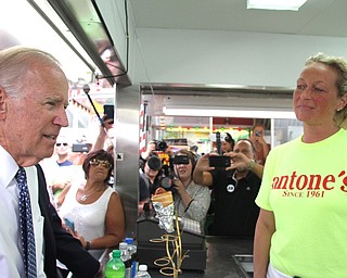 Nikos Frazier | The Vindicator..Vice President Joe Biden looks at the menu of Antones Concession at the Canfield Fair on Thursday, Sept. 1, 2016.