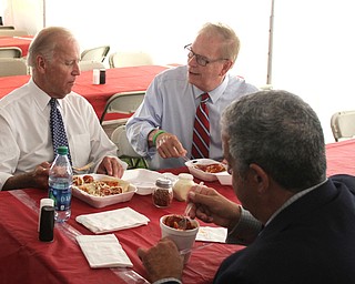 Nikos Frazier | The Vindicator..Vice President Joe Biden sits down with Former Ohio Gov. Ted Strickland and Dave Betras, chairman of the Mahoning County Democratic Party, at Antones Concession at the Canfield Fair on Thursday, Sept. 1, 2016.