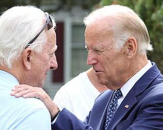 Nikos Frazier | The Vindicator..Vice President Joe Biden greets a resident on Lanterman Ave. in Youngstown, Oh. on Thursday, Sept. 1, 2016.