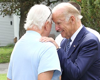 Nikos Frazier | The Vindicator..Vice President Joe Biden greets a resident on Lanterman Ave. in Youngstown, Oh. on Thursday, Sept. 1, 2016.