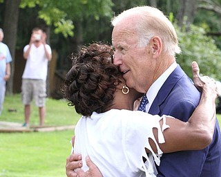 Nikos Frazier | The Vindicator..Vice President Joe Biden greets a resident on Lanterman Ave. in Youngstown, Oh. on Thursday, Sept. 1, 2016.