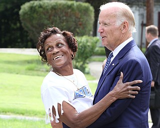 Nikos Frazier | The Vindicator..Vice President Joe Biden greets a resident on Lanterman Ave. in Youngstown, Oh. on Thursday, Sept. 1, 2016.