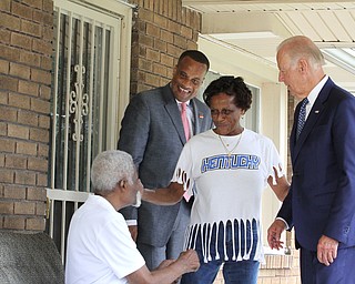 Nikos Frazier | The Vindicator..Vice President Joe Biden is introduced to residents on Lanterman Ave. in Youngstown, Oh. with former Youngstown Mayor, Jay Williams(standing left) on Thursday, Sept. 1, 2016.