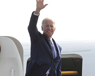 Nikos Frazier | The Vindicator..Vice President Joe Biden waves goodbye to the Mahoning Valley before boarding Air Force Two at the YoungstownÐWarren Air Reserve Station in Vienna, Oh. on Thursday, Sept. 1, 2016.