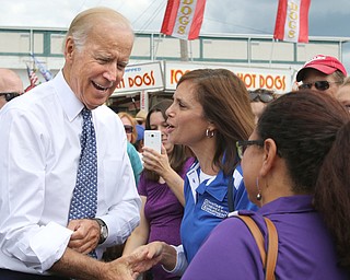        ROBERT K. YOSAY  | THE VINDICATOR..Getting a hello and a hand shake  from Joe Biden is Laura Ferraro.....of Austintown..Biden visits Canfield Fair... - -30-...