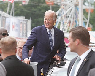        ROBERT K. YOSAY  | THE VINDICATOR..Joe Biden gets up on his car and smiles as he leaves the  fair..... - -30-...