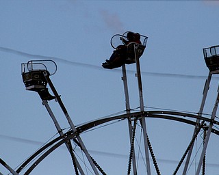        ROBERT K. YOSAY  | THE VINDICATOR..A ferris wheel rider..  points to a part of the fair...Biden visits Canfield Fair... - -30-...