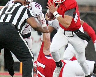 William D. Lewis/The Vindicator YSU QB Ricky Davis(12) scrambles fro 1rst qtr yardage during Sept. 1, 2016 game with Duquesne.09012016 wdl ysu a..