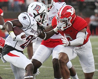 William D. Lewis/The Vindicator YSU Leroy Alexander(3)) stops Duquesne's Chayse Dillon(20) during 1rst qtr of Sept. 1, 2016 game with Duquesne